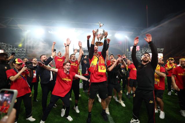 French midfielder #28 Adrien Thomasson and Lens' French defender #24 Jonathan Gradit celebrates after Lens RC won the French Cup final football match against Nice OGC in Lens, northern France, on May 22, 2026. (Photo by FRANCK FIFE / AFP)