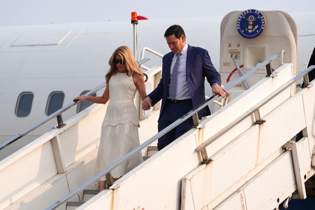 US Secretary of State Marco Rubio disembarks his plane with his wife Jeanette at Netaji Subhash Chandra Bose International Airport in Kolkata on May 23, 2026. Rubio arrived May 23 on his first trip to India where he will meet Prime Minister Narendra Modi on the heels of US diplomacy with China. (Photo by Julia Demaree Nikhinson / POOL / AFP)