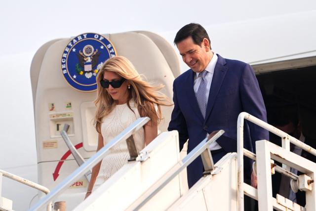 US Secretary of State Marco Rubio disembarks his plane with his wife Jeanette at Netaji Subhash Chandra Bose International Airport in Kolkata on May 23, 2026. Rubio arrived May 23 on his first trip to India where he will meet Prime Minister Narendra Modi on the heels of US diplomacy with China. (Photo by Julia Demaree Nikhinson / POOL / AFP)