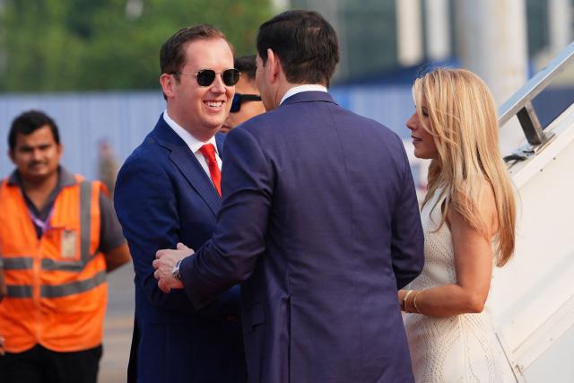 US Secretary of State Marco Rubio and his wife Jeanette are greeted by the US Ambassador to India Sergio Gor (L) at Netaji Subhash Chandra Bose International Airport in Kolkata on May 23, 2026. Rubio arrived May 23 on his first trip to India where he will meet Prime Minister Narendra Modi on the heels of US diplomacy with China. (Photo by Julia Demaree Nikhinson / POOL / AFP)
