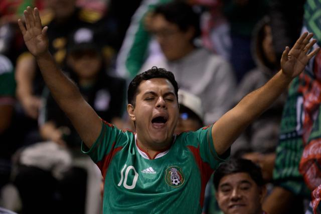 A fan of Mexico cheers for his team during a friendly football match between Mexico and Ghana at the Cuauhtemoc Stadium in Puebla, Mexico, on May 22, 2026. (Photo by Alfredo ESTRELLA / AFP)