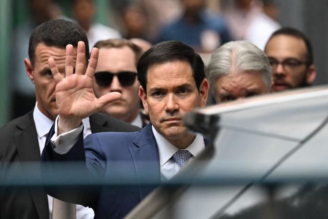 US Secretary of State Marco Rubio gestures as he walks out of the international headquarters of Missionaries of Charity known as the "Mother House" in Kolkata on May 23, 2023. (Photo by Dibyangshu SARKAR / AFP)