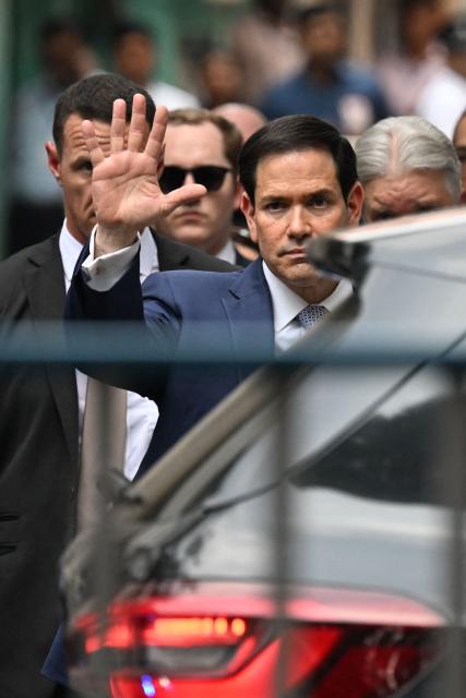 US Secretary of State Marco Rubio gestures as he walks out of the international headquarters of Missionaries of Charity known as the "Mother House" in Kolkata on May 23, 2023. (Photo by Dibyangshu SARKAR / AFP)
