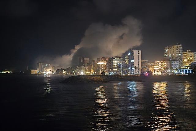 Smoke rises from the site of an Israeli strike that targeted an area in the southern Lebanon coastal city of Tyre on May 23, 2026. Two buildings in and around the southern Lebanese city of Tyre were struck overnight on May 22 into May 23, after the Israeli military issued an evacuation warning. (Photo by KAWANT HAJU / AFP)