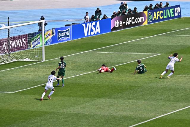 North Korea's Naegohyang Women's FC forward Kim Kyong Yong (R) celebrates her goal during the AFC Women's Champions League final football match between North Korea's Naegohyang Women's FC and Japan's Tokyo Verdy Beleza at Suwon Sports Complex in Suwon on May 23, 2026. (Photo by Pedro Pardo / AFP)