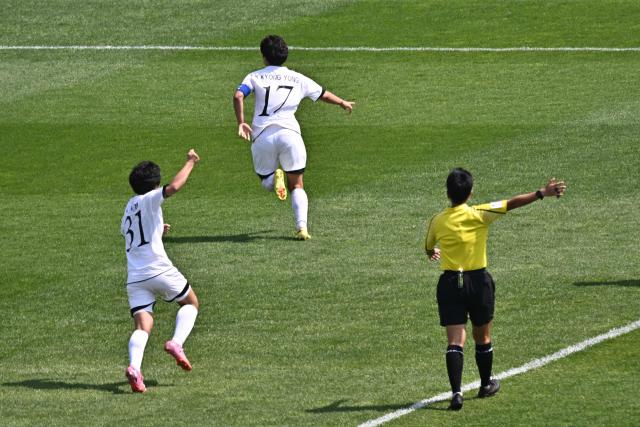 North Korea's Naegohyang Women's FC forward Kim Kyong Yong (C) celebrates with her teammates after scoring during the AFC Women's Champions League final football match betwee North Korea's Naegohyang Women's FC and Japan's Tokyo Verdy Beleza at Suwon Sports Complex in Suwon on May 23, 2026. (Photo by Pedro Pardo / AFP)