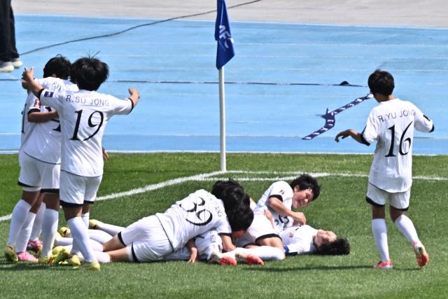 North Korea's Naegohyang Women's FC forward Kim Kyong Yong celebrates with her teammates after scoring during the AFC Women's Champions League final football match betwee North Korea's Naegohyang Women's FC and Japan's Tokyo Verdy Beleza at Suwon Sports Complex in Suwon on May 23, 2026. (Photo by Pedro Pardo / AFP)