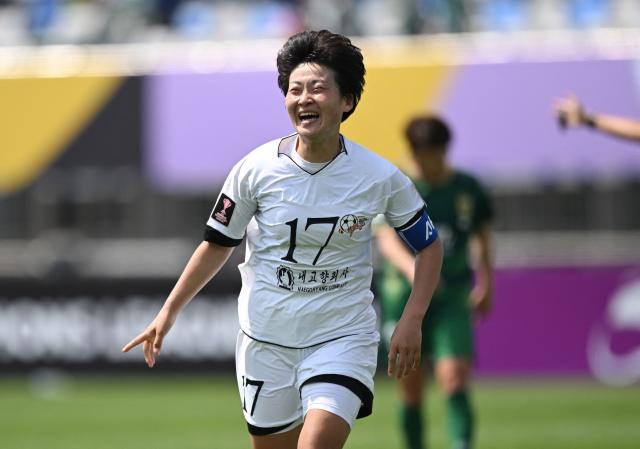 Kim Kyong Yong of Naegohyang Women's FC celebrates scoring her team's first goal during the AFC Women's Champions League final football match between North Korea's Naegohyang Women's FC and Japan's Tokyo Verdy Beleza in Suwon on May 23, 2026. (Photo by JUNG YEON-JE / AFP)