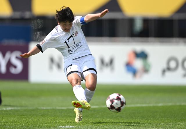Kim Kyong Yong (C #17) of Naegohyang Women's FC celebrates shoots her team's first goal during the AFC Women's Champions League final football match between North Korea's Naegohyang Women's FC and Japan's Tokyo Verdy Beleza in Suwon on May 23, 2026. (Photo by JUNG YEON-JE / AFP)