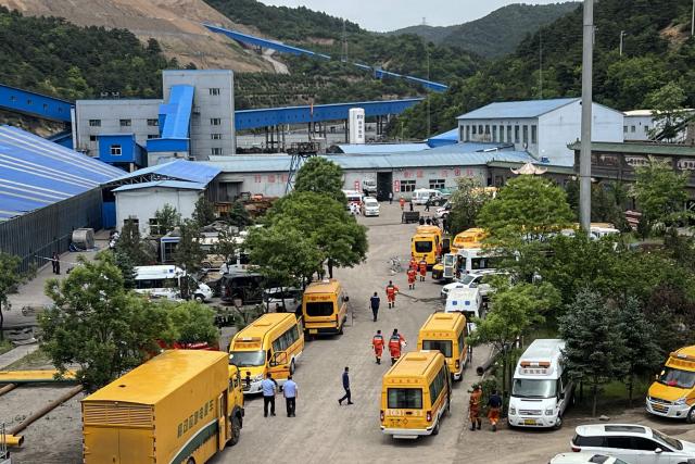 A general view of rescue team members and emergency vehicles arriving at the Liushenyu coal mine after a gas explosion in Changzhi, in northern China's Shanxi province on May 23, 2026. A gas explosion at a coal mine in northern China has killed at least 82 people, state media reported, in one of the country's biggest industrial disasters of recent years. (Photo by CNS / AFP) / China OUT