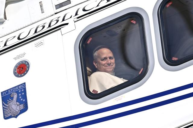 Pope Leo XIV arrives by helicopter in Acerra for a pastoral visit to the community of the 'Land of Fires' on May 23, 2026. The Land of Fires (terra dei fuochi) is an area in the Southern Italian region of Campania were, systematically, since the end of the 80s, toxic wastes have been dumped by organized crime (Camorra) causing waste-related environmental crimes. Acerra and the surrounding territory has higher-than-average cancer rates, linked to the dumping, burning, and burying of toxic waste. (Photo by Filippo MONTEFORTE / AFP)