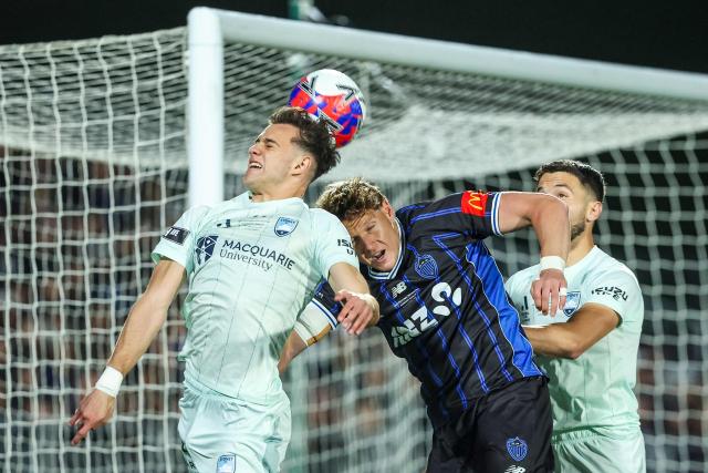 Sydney FC's Paul Okon-Engstler (L) and Auckland FC's Nando Pijnaker (2nd R) fight for the ball during the A League Grand final football match between Auckland FC and Sydney FC at Go Media Stadium in Auckland on May 23, 2026. (Photo by DJ MILLS / AFP)