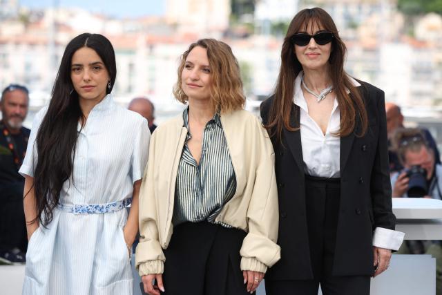 (FROM L) French actress Hafsia Herzi, French screenwriter Lea Mysius and Italian actress Monica Bellucci pose during a photocall of the film "Histoires de la nuit" (The Birthday Party) at the 79th edition of the Cannes Film Festival in Cannes, southern France on May 23, 2026. (Photo by Valery HACHE / AFP)