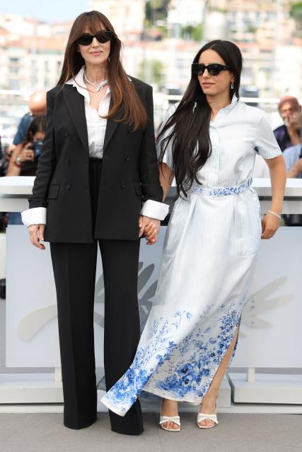 Italian actress Monica Bellucci and French actress Hafsia Herzi pose during a photocall of the film "Histoires de la nuit" (The Birthday Party) at the 79th edition of the Cannes Film Festival in Cannes, southern France on May 23, 2026. (Photo by Valery HACHE / AFP)