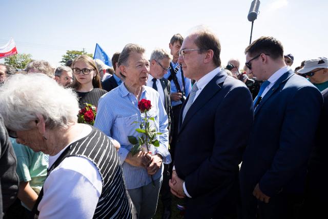 German Interior Minister Alexander Dobrindt (C) attends an event organised by the "Union of Expellees within the Christian Social Union party" (UdVA, Union der Vertriebenen, Aussiedler und Deutschen Minderheiten der CSU) to commemorate the flight and expulsion of Sudeten Germans during and after World War II, on May 23, 2026 in Pohorelice, South Moravia, Czech Republic. (Photo by Radek MICA / AFP)
