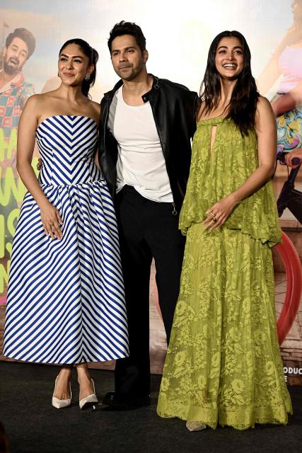 Bollywood actors Mrunal Thakur (L), Varun Dhawan (C) and Pooja Hegde attend the trailer launch of their upcoming Indian Hindi-language romantic comedy film 'Hai Jawani Toh Ishq Hona Hai' in Mumbai on May 23, 2026. (Photo by Sujit JAISWAL / AFP)