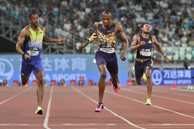 Botswana's Busang Collen Kebinatshipi (C) crosses the finish line to win in the men's 400m final event during the Xiamen Diamond League athletics meeting at Egret Stadium in Xiamen, in China’s eastern Fujian province on May 23, 2026. (Photo by Hector RETAMAL / AFP)