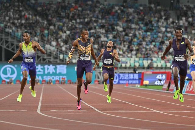 Botswana's Busang Collen Kebinatshipi (2nd L) crosses the finish line to win in the men's 400m final event during the Xiamen Diamond League athletics meeting at Egret Stadium in Xiamen, in China’s eastern Fujian province on May 23, 2026. (Photo by Hector RETAMAL / AFP)