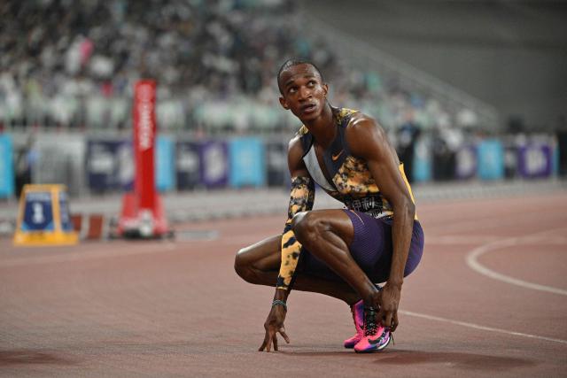 Botswana's Busang Collen Kebinatshipi (R) looks on after winning in the men's 400m final event during the Xiamen Diamond League athletics meeting at Egret Stadium in Xiamen, in China’s eastern Fujian province on May 23, 2026. (Photo by Hector RETAMAL / AFP)