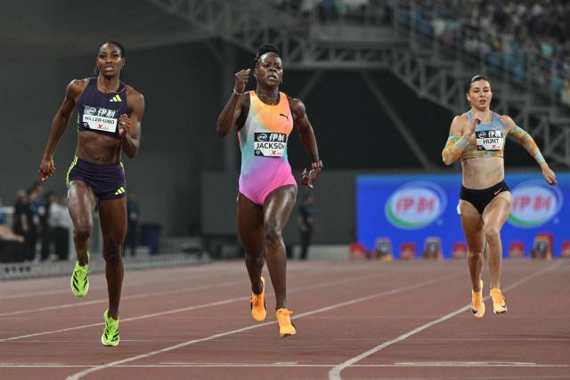 Jamaica's Sherika Jackson (C) crosses the finish line to win in the women's 200m final event during the Xiamen Diamond League athletics meeting at Egret Stadium in Xiamen, in China’s eastern Fujian province on May 23, 2026. (Photo by Hector RETAMAL / AFP)