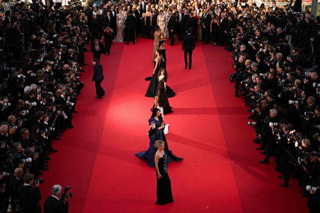 (FILES) US actress Gillian Anderson (front) arrives for the screening of the film "Histoires de la nuit" (The Birthday Party) at the 79th edition of the Cannes Film Festival in Cannes, southern France on May 22, 2026.  (Photo by Antonin THUILLIER / AFP)