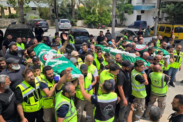 Mourners carry the bodies of victims, who were killed following an Israeli strike, during their funeral in Deïr Qanoun en Nahr village near the southern Lebanese coastal city of Tyre on May 23, 2026. Israel staged fresh airstrikes in Lebanon on May 23 after earlier raids killed 10 people, according to media and the government in Beirut, targeting an area near the Syrian border. (Photo by KAWNAT HAJU / AFP)