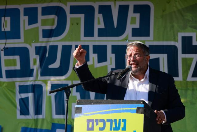 (FILES) Israeli far-right minister Itamar Ben Gvir delivers a speech during a gathering by right-wing activists near the border with Gaza on October 21, 2024, calling to establish a new Jewish settlement in the Gaza Strip, during the holiday of Sukkot, or the Feast of the Tabernacles, amid the ongoing war in the Palestinian territory between Israel and Hamas. France has banned Israeli National Security Minister Itamar Ben-Gvir from entering the country after he posted a video showing activists from the “Gaza flotilla” kneeling with their hands tied, sparking an international outcry, France's Foreign Affairs Minister Jean-Noel Barrot announced on May 23, 2026 on his X account, condemning "unspeakable acts against French and European citizens travelling on the Global Sumud flotilla". (Photo by Menahem KAHANA / AFP)