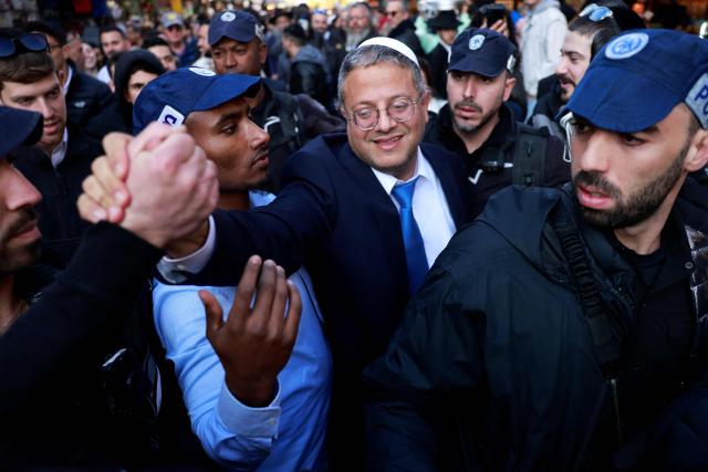 (FILES) Itamar Ben Gvir, Israel's new Minister of National Security and leader of the far-right Otzma Yehudit (Jewish Power) party, greets supporters during a visit to Jerusalem's Mahane Yehuda market on December 30, 2022. France has banned Israeli National Security Minister Itamar Ben-Gvir from entering the country after he posted a video showing activists from the “Gaza flotilla” kneeling with their hands tied, sparking an international outcry, France's Foreign Affairs Minister Jean-Noel Barrot announced on May 23, 2026 on his X account, condemning "unspeakable acts against French and European citizens travelling on the Global Sumud flotilla". (Photo by Menahem KAHANA / AFP)