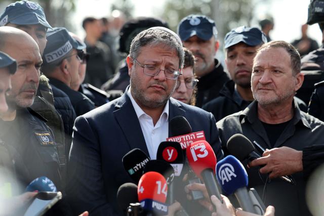 EDITORS NOTE: Graphic content / (FILES) Israeli far-right minister Itamar Ben-Gvir speaks to the press at the scene of a shooting attack in the southern town of Kiryat Malakhi on February 16, 2024. France has banned Israeli National Security Minister Itamar Ben-Gvir from entering the country after he posted a video showing activists from the “Gaza flotilla” kneeling with their hands tied, sparking an international outcry, France's Foreign Affairs Minister Jean-Noel Barrot announced on May 23, 2026 on his X account, condemning "unspeakable acts against French and European citizens travelling on the Global Sumud flotilla". (Photo by AHMAD GHARABLI / AFP)