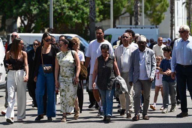 Mourners take part in a commemorative march in tribute to the victims of a shooting in Nice, south-eastern France on May 23, 2026. Two men and a woman suspected of being involved in the shooting that left two people dead and six injured in Nice on May 11, 2026  have been charged and remanded in custody, in a new case illustrating the “turf wars” associated with drug-related gang activity. (Photo by Miguel MEDINA / AFP)