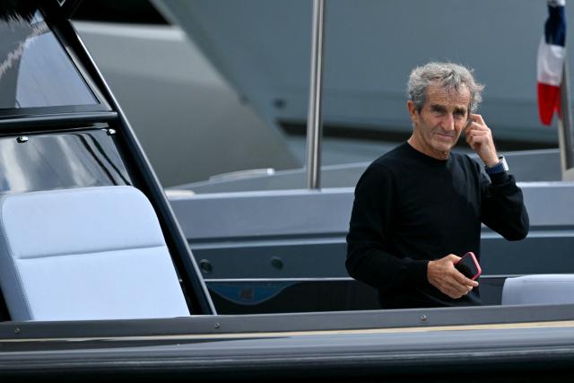 (FILES) French former driver Alain Prost arrives by boat in the paddock of the Circuit de Monaco before the third practice session of the Formula One Monaco Grand Prix on May 25 2024, on the eve of the race. French four-time Formula One champion Alain Prost was injured during a violent robbery at his home in Switzerland, Swiss media reported on May 23, 2026. (Photo by NICOLAS TUCAT / AFP)