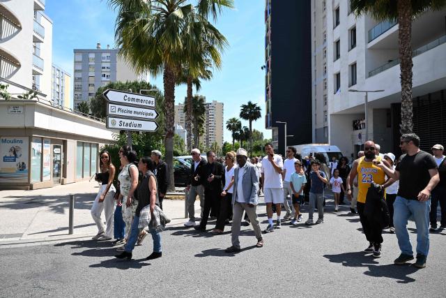 Mourners take part in a commemorative march in tribute to the victims of a shooting in Nice, south-eastern France on May 23, 2026. Two men and a woman suspected of being involved in the shooting that left two people dead and six injured in Nice on May 11, 2026  have been charged and remanded in custody, in a new case illustrating the “turf wars” associated with drug-related gang activity. (Photo by Miguel MEDINA / AFP)