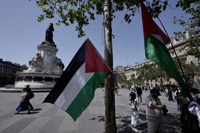 This photograph shows Palestinian flags as French activists of the Global Sumud Gaza-bound flotilla and protesters take part in a demonstration in solidarity with Palestinians, to condemn the interception of the Global Sumud Flotilla by the Israeli army, at the Place de la Republique in Paris on May 23, 2026. The 37 French nationals were among some 430 activists from 40 countries aboard the Global Sumud Flotilla, intercepted by the Israeli navy in international waters on May 18, 2026 in the latest string of attempts to break the blockade of the Palestinian territory. (Photo by STEPHANE DE SAKUTIN / AFP)