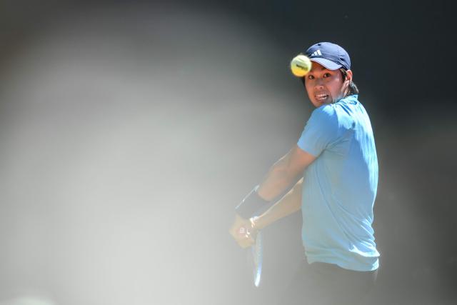 USA's Learner Tien eyes a ball during his men's singles final tennis match against Argentine's Mariano Navone at the ATP 250 Geneva Open tennis tournament in Geneva on May 23, 2026. (Photo by Fabrice COFFRINI / AFP)