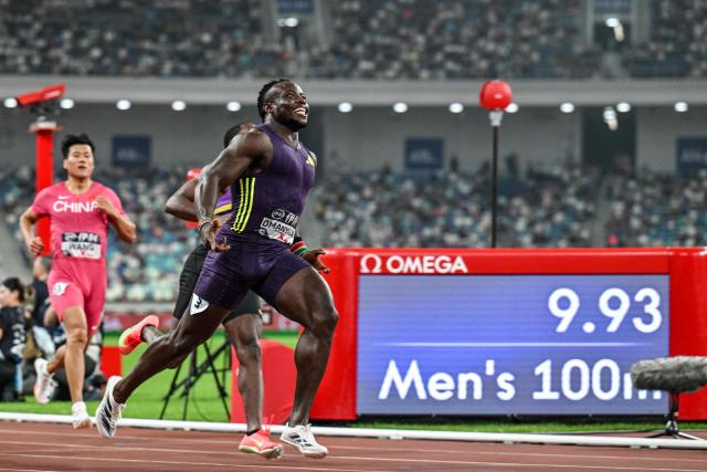 Kenya's Ferdinand Omanyala reacts after crossing the finish line to win in the men's 100m event during the Diamond League Xiamen athletics meeting in Xiamen, in China’s southeast Fujian province on May 23, 2026. (Photo by Hector RETAMAL / AFP)