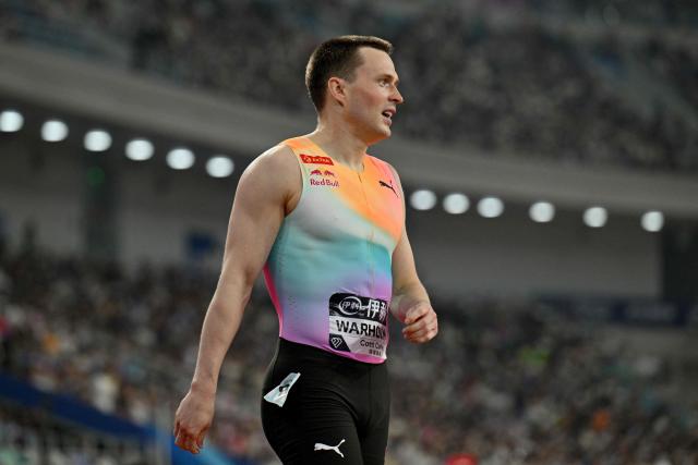 Second-placed Norway's Karsten Warholm looks on at the end of the men's 400m hurdles final event during the Xiamen Diamond League athletics meeting at Egret Stadium in Xiamen, in China’s eastern Fujian province on May 23, 2026. (Photo by Hector RETAMAL / AFP)