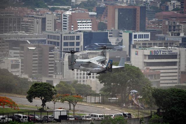 A US Marines MV-22B Osprey aircraft lands at the US Embassy, in Caracas, on May 23, 2026, during an air evacuation drill. (Photo by Federico PARRA / AFP)