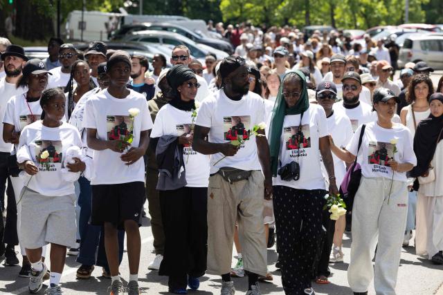 Felix Mankoka (C), Olga Mankoka (2R) and relatives walk as they take part in a silent march in tribute to their son Elidjah Mankoka in Nantes, western France on May 23, 2026, after his death by shooting on May 14. The death of fifteen year-old Elidjah along with the wounding of two other minors on the same day, took place in the Port-Boyer neighbourhood on the western French city, which had already been hit by deadly shootings linked to drug trafficking earlier in the year. (Photo by Fred TANNEAU / AFP)