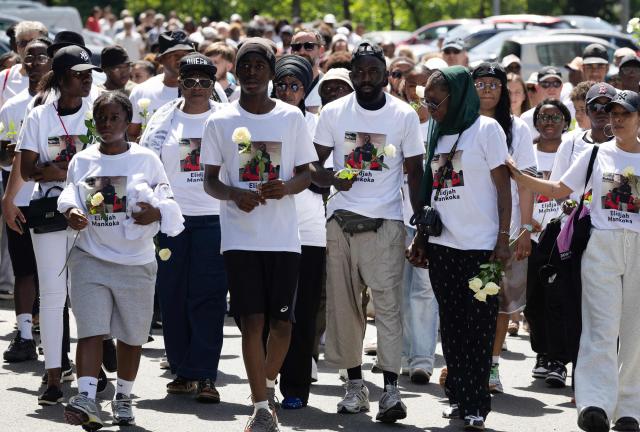 Felix Mankoka (C), Olga Mankoka (2R) and relatives walk as they take part in a silent march in tribute to their son Elidjah Mankoka in Nantes, western France on May 23, 2026, after his death by shooting on May 14. The death of fifteen year-old Elidjah along with the wounding of two other minors on the same day, took place in the Port-Boyer neighbourhood on the western French city, which had already been hit by deadly shootings linked to drug trafficking earlier in the year. (Photo by Fred TANNEAU / AFP)