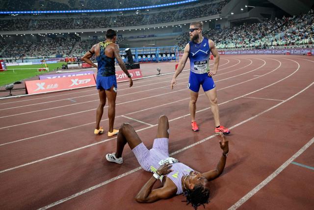 Brazil's Alison Dos Santos (below) reacts after winning the men's 400m hurdles final event during the Xiamen Diamond League athletics meeting at Egret Stadium in Xiamen, in China’s eastern Fujian province on May 23, 2026. (Photo by Hector RETAMAL / AFP)