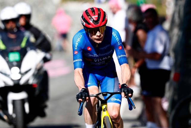 Team Visma Lease a Bike Danish rider Jonas Vingegaard climbs to win the 14th stage of the Giro d'Italia 2026 - Tour of Italy cycling race between Aosta and Pila (Gressan), Italy, on May 23, 2026. (Photo by Luca Bettini / AFP)