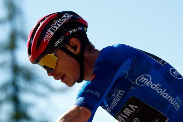 Team Visma Lease a Bike Danish rider Jonas Vingegaard climbs to win the 14th stage of the Giro d'Italia 2026 - Tour of Italy cycling race between Aosta and Pila (Gressan), Italy, on May 23, 2026. (Photo by Luca Bettini / AFP)