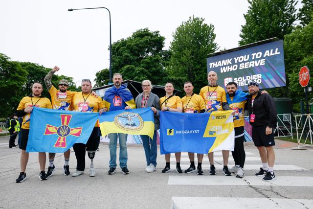 Active-duty Ukrainian service members participate in the annual Soldier Field 10 race and other commemorative activities to honor fallen American and Ukrainian service members during a Memorial Day tribute in Chicago, on May 23, 2026. Active-duty Ukrainian soldiers participate in the annual Soldier Field 10 race and other commemorative activities to honor fallen American and Ukrainian service members during a Memorial Day tribute in Chicago, on May 23, 2026. (Photo by KAMIL KRZACZYNSKI / AFP)