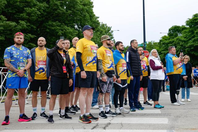 Active-duty Ukrainian soldiers participate in the annual Soldier Field 10 race and other commemorative activities to honor fallen American and Ukrainian service members during a Memorial Day tribute in Chicago, on May 23, 2026. Active-duty Ukrainian soldiers participate in the annual Soldier Field 10 race and other commemorative activities to honor fallen American and Ukrainian service members during a Memorial Day tribute in Chicago, on May 23, 2026. (Photo by KAMIL KRZACZYNSKI / AFP)