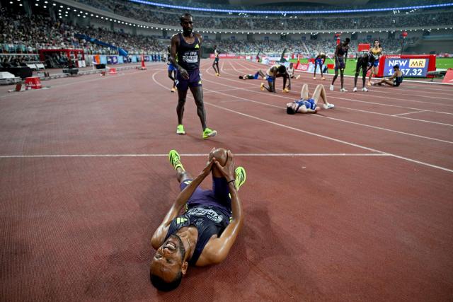 Ethiopia's Addisu Yihune (below) reacts after winning the men's 5000m final event during the Xiamen Diamond League athletics meeting at Egret Stadium in Xiamen, in China’s eastern Fujian province on May 23, 2026. (Photo by Hector RETAMAL / AFP)