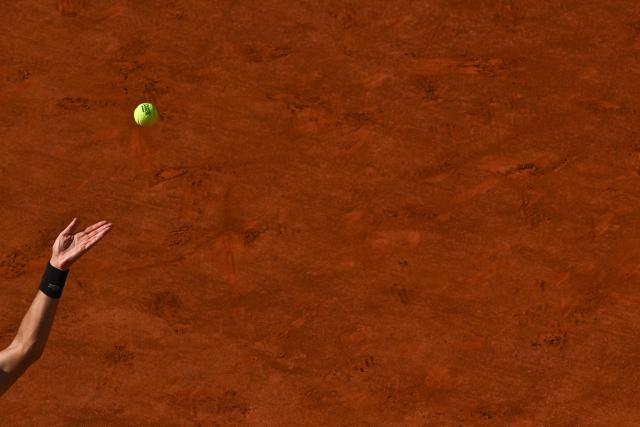 Serbia's Novak Djokovic serves as he practices on Court Philippe-Chatrier during the French Open tennis tournament at the Roland-Garros Complex in Paris on May 23, 2026. (Photo by JULIEN DE ROSA / AFP)