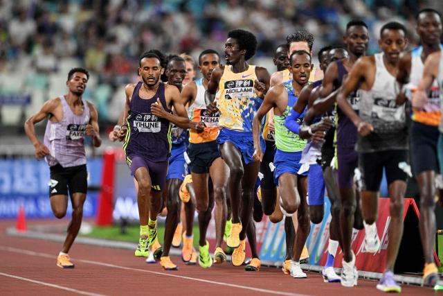 Ethiopia's Addisu Yihune (2L) competes in the men's 5000m final event during the Xiamen Diamond League athletics meeting at Egret Stadium in Xiamen, in China’s eastern Fujian province on May 23, 2026. (Photo by Hector RETAMAL / AFP)