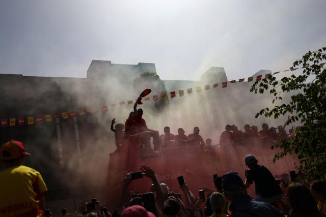 RC Lens' players parade for supporters atop a double-decker bus during celebrations following their victory in the French Cup final football match against OGC Nice, in Lens, northern France on May 23, 2026. (Photo by FRANCK FIFE / AFP)