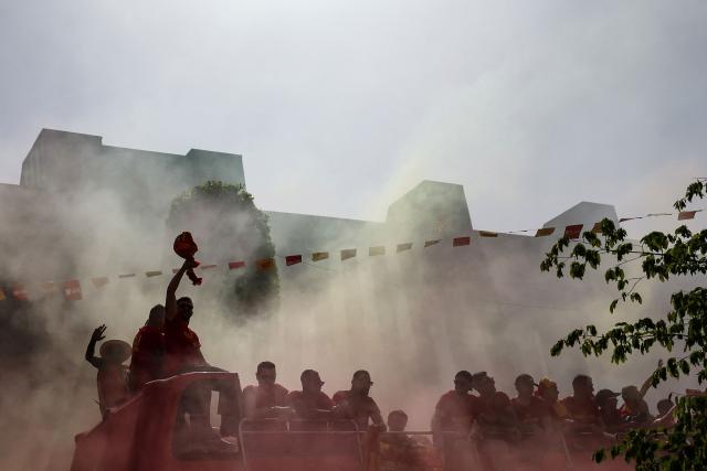 RC Lens' players parade for supporters atop a double-decker bus during celebrations following their victory in the French Cup final football match against OGC Nice, in Lens, northern France on May 23, 2026. (Photo by FRANCK FIFE / AFP)