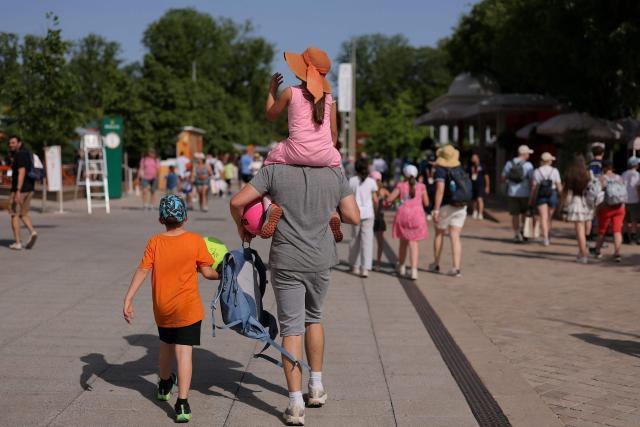 Visitors walk at the Roland-Garros Complex during the French Open tennis tournament in Paris on May 23, 2026. (Photo by Thomas SAMSON / AFP)